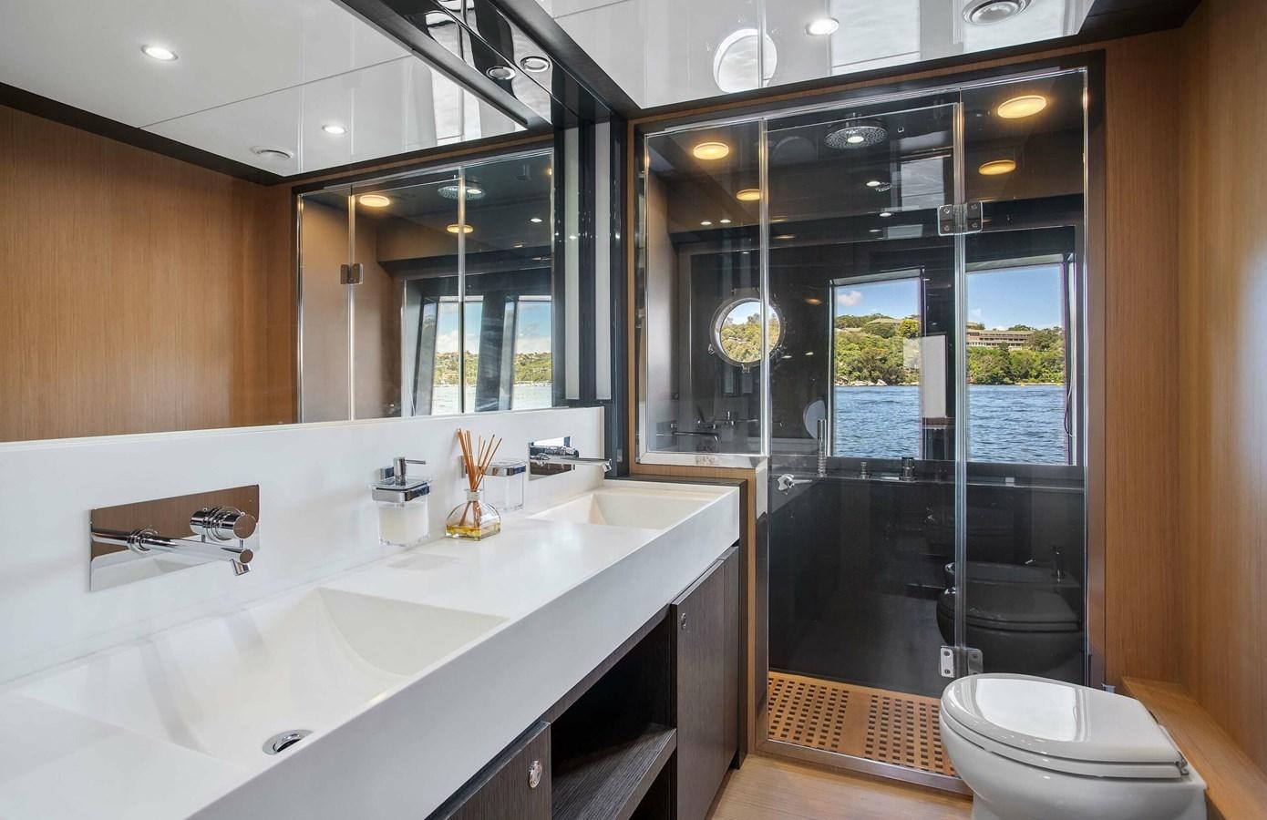 a bathroom with a large glass shower aboard RIVA 88 DOMINO Yacht for Sale