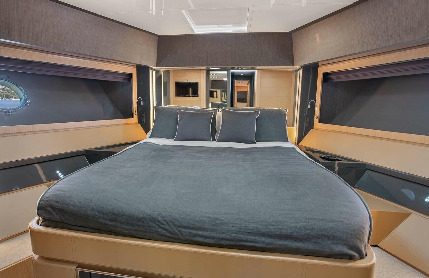 a bed in a room aboard RIVA 88 DOMINO Yacht for Sale
