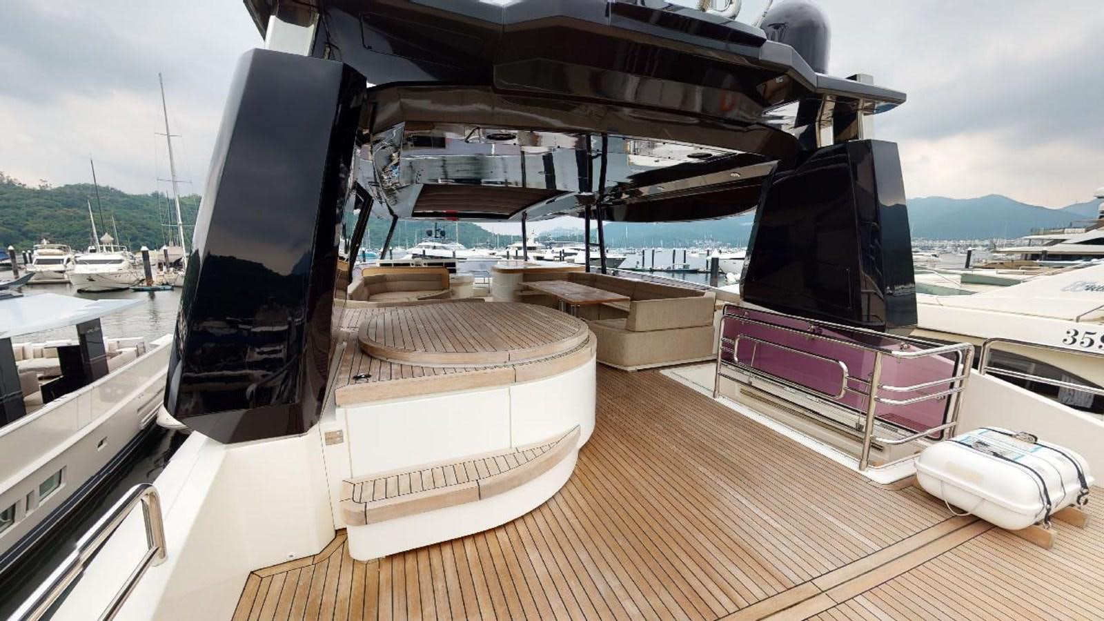 a deck with a tv and a deck with boats on it aboard MCY 86/04 Yacht for Sale