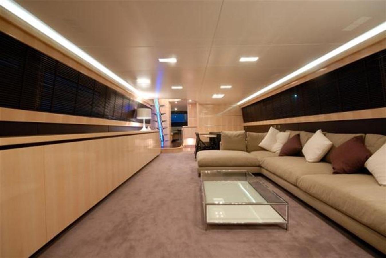 a large room with a couch and a table aboard SANS SOUCI Yacht for Sale