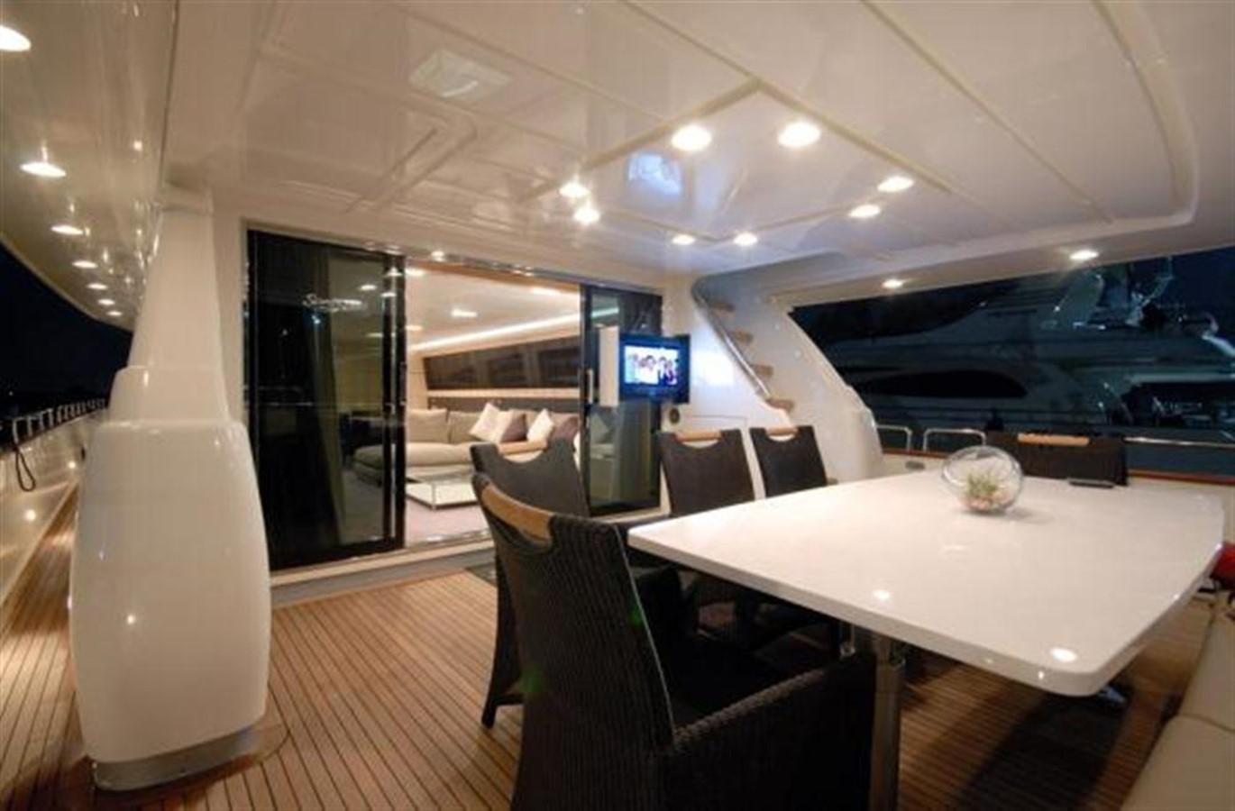 a room with a table and chairs aboard SANS SOUCI Yacht for Sale