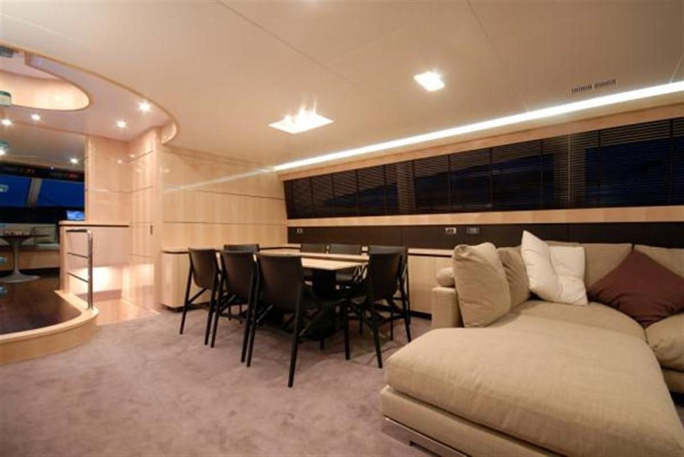 a living room with a couch and a table aboard SANS SOUCI Yacht for Sale