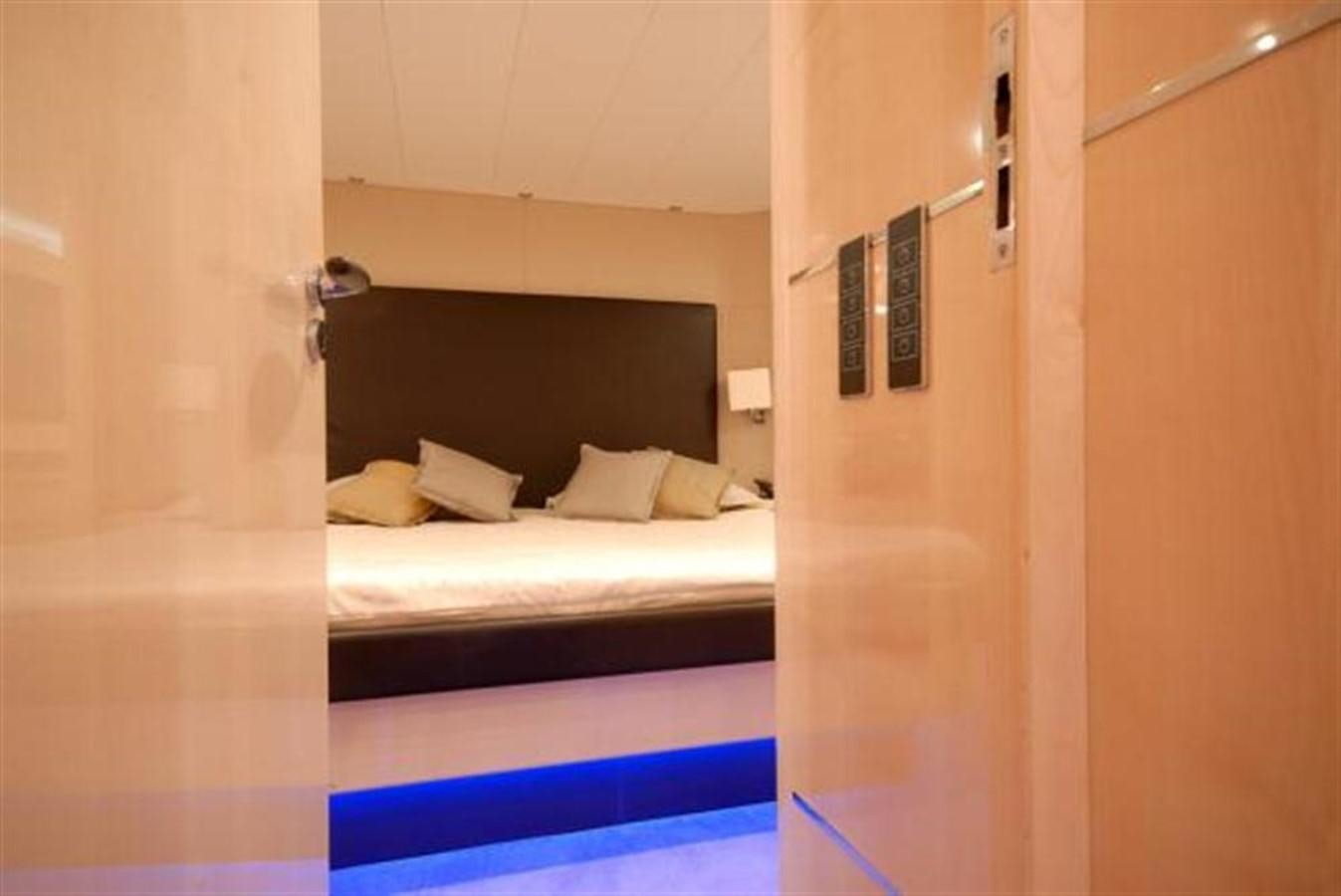 a room with a bed and a closet aboard SANS SOUCI Yacht for Sale