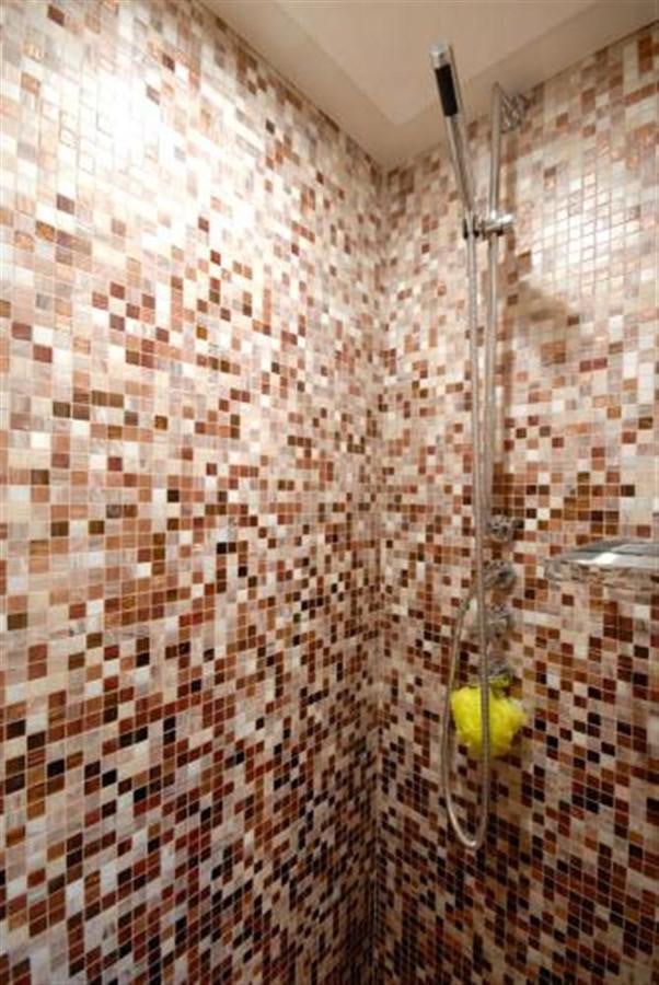 a shower with a shower curtain aboard SANS SOUCI Yacht for Sale