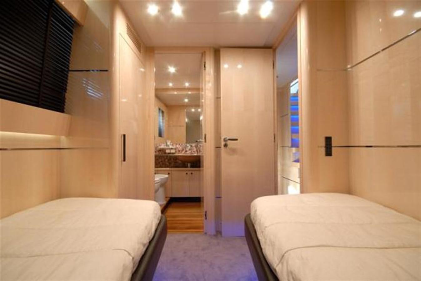 a room with a couple of beds aboard SANS SOUCI Yacht for Sale