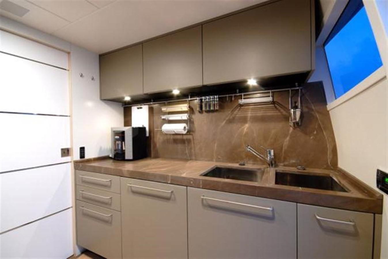 a kitchen with a sink and cabinets aboard SANS SOUCI Yacht for Sale
