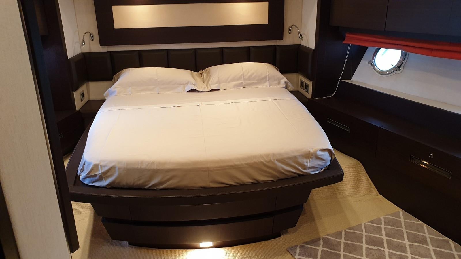 a bed with a white sheet aboard MR LEO Yacht for Sale