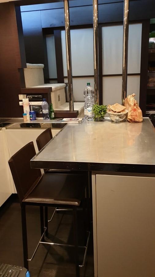 a kitchen with a counter and a sink aboard MR LEO Yacht for Sale