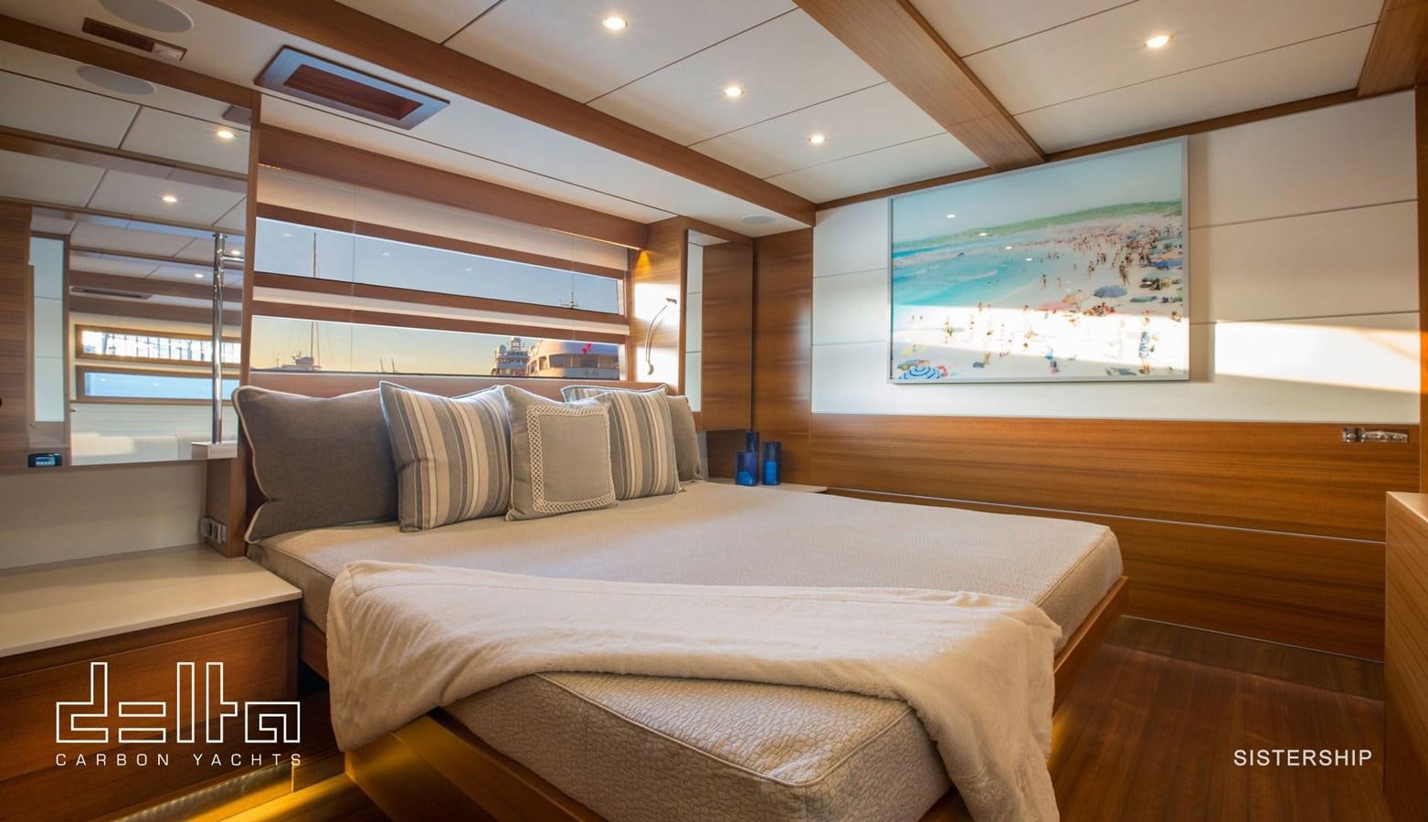 a room with a bed and a television aboard DELTA 88 CARBON Yacht for Sale