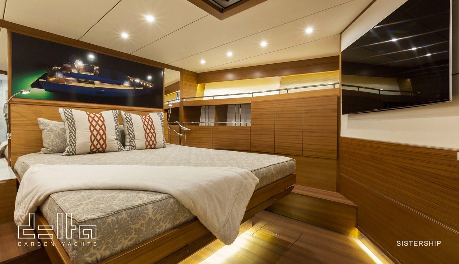 a room with a bed and a wood wall aboard DELTA 88 CARBON Yacht for Sale