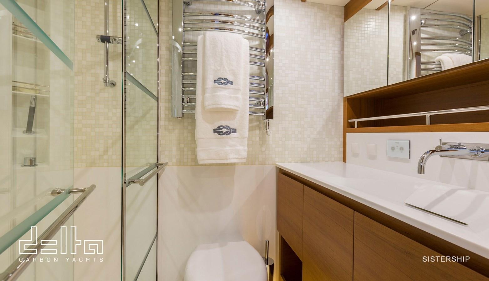 a bathroom with a shower and sink aboard DELTA 88 CARBON Yacht for Sale