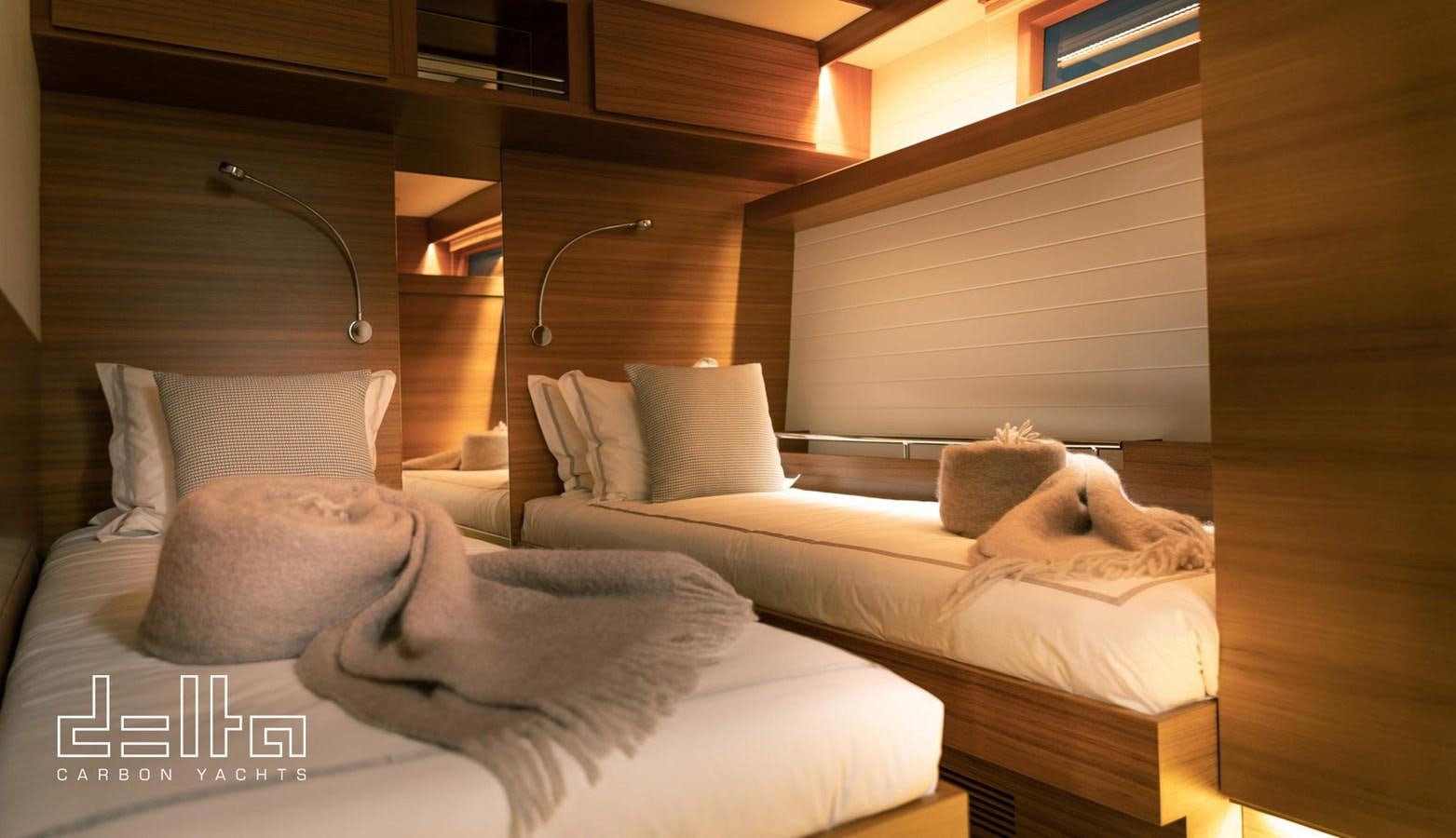 a couple of beds in a room aboard DELTA 88 CARBON Yacht for Sale