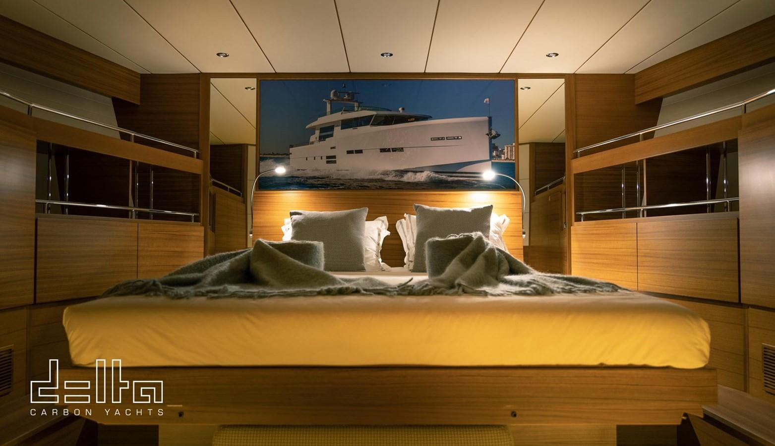 a bed with pillows aboard DELTA 88 CARBON Yacht for Sale