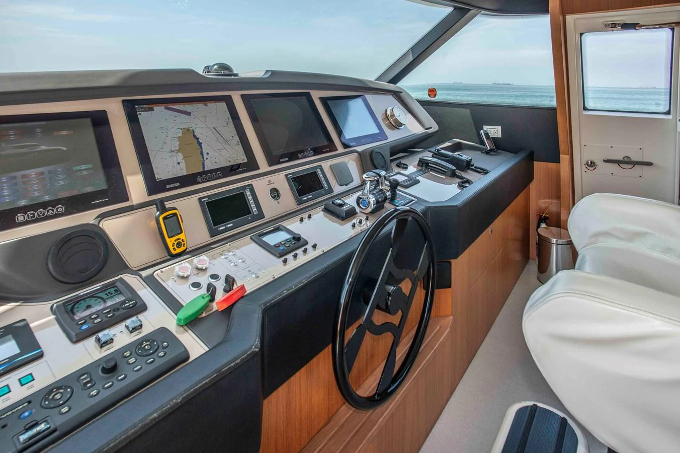 a computer desk with a large screen aboard NUR Yacht for Sale