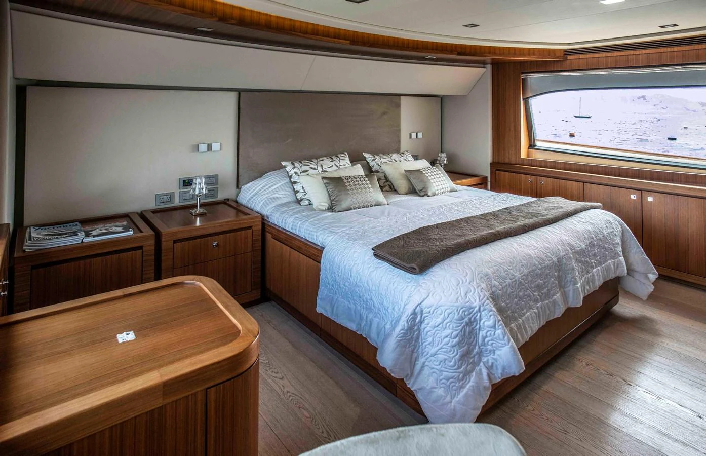 a bedroom with a bed and a desk aboard NUR Yacht for Sale