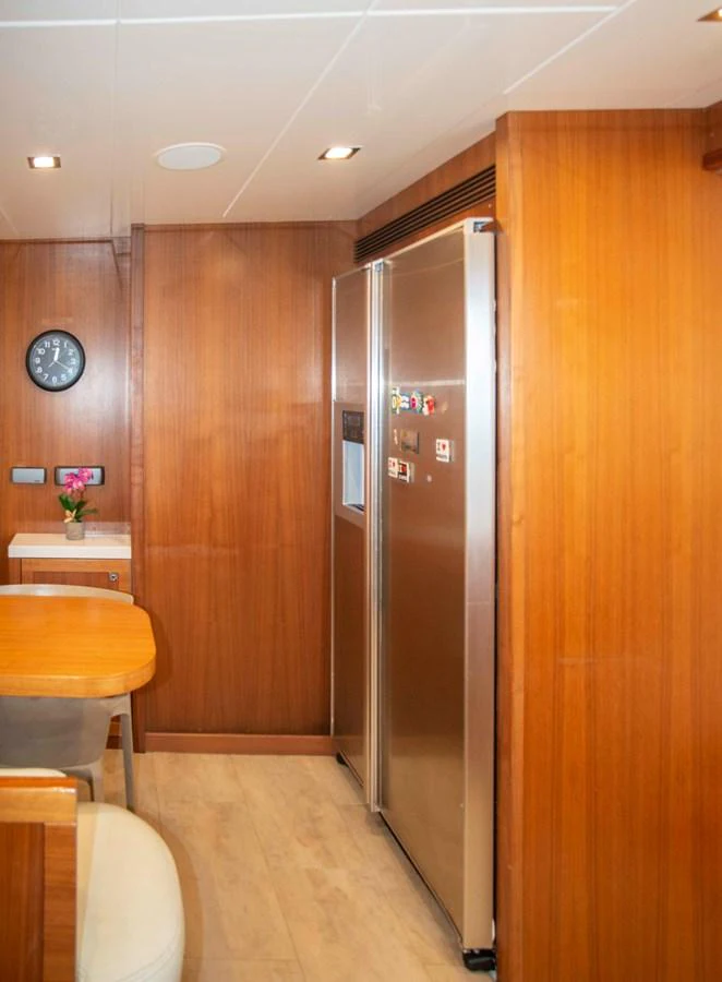 a kitchen with a refrigerator aboard NUR Yacht for Sale