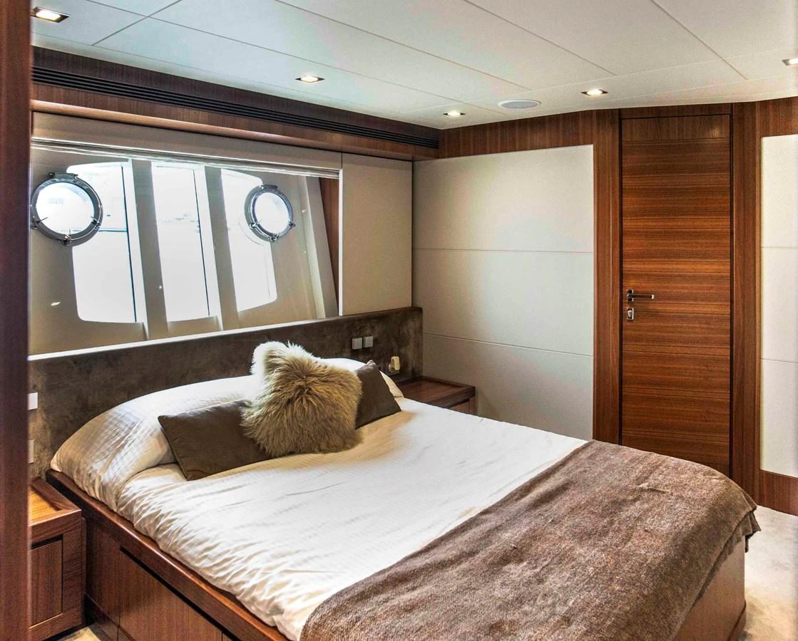 a bed in a room aboard NUR Yacht for Sale