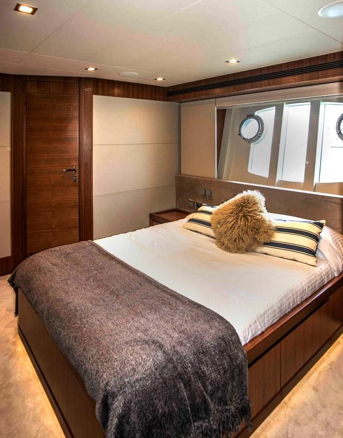 a bed with a pillow aboard NUR Yacht for Sale