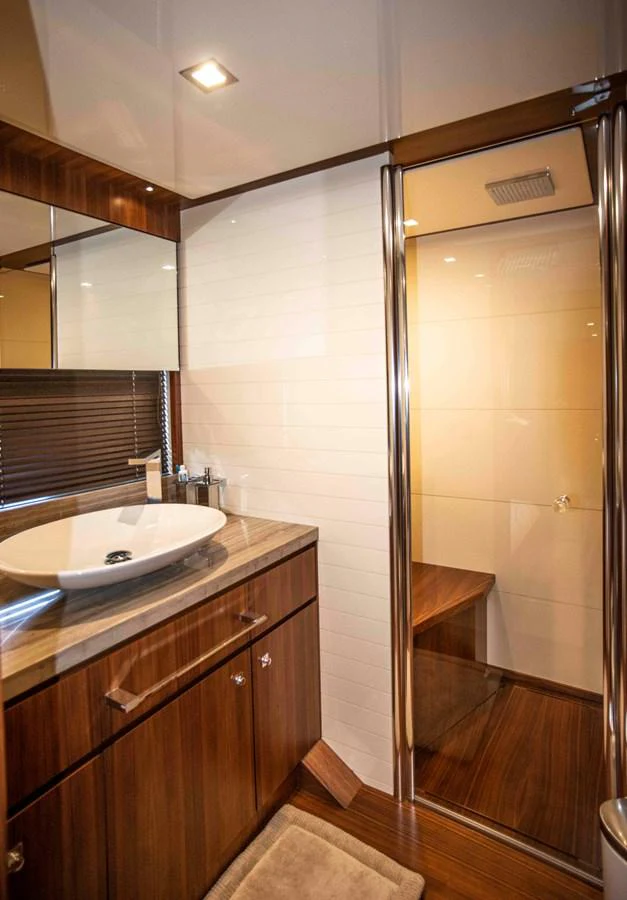 a bathroom with a sink and a shower unit aboard NUR Yacht for Sale