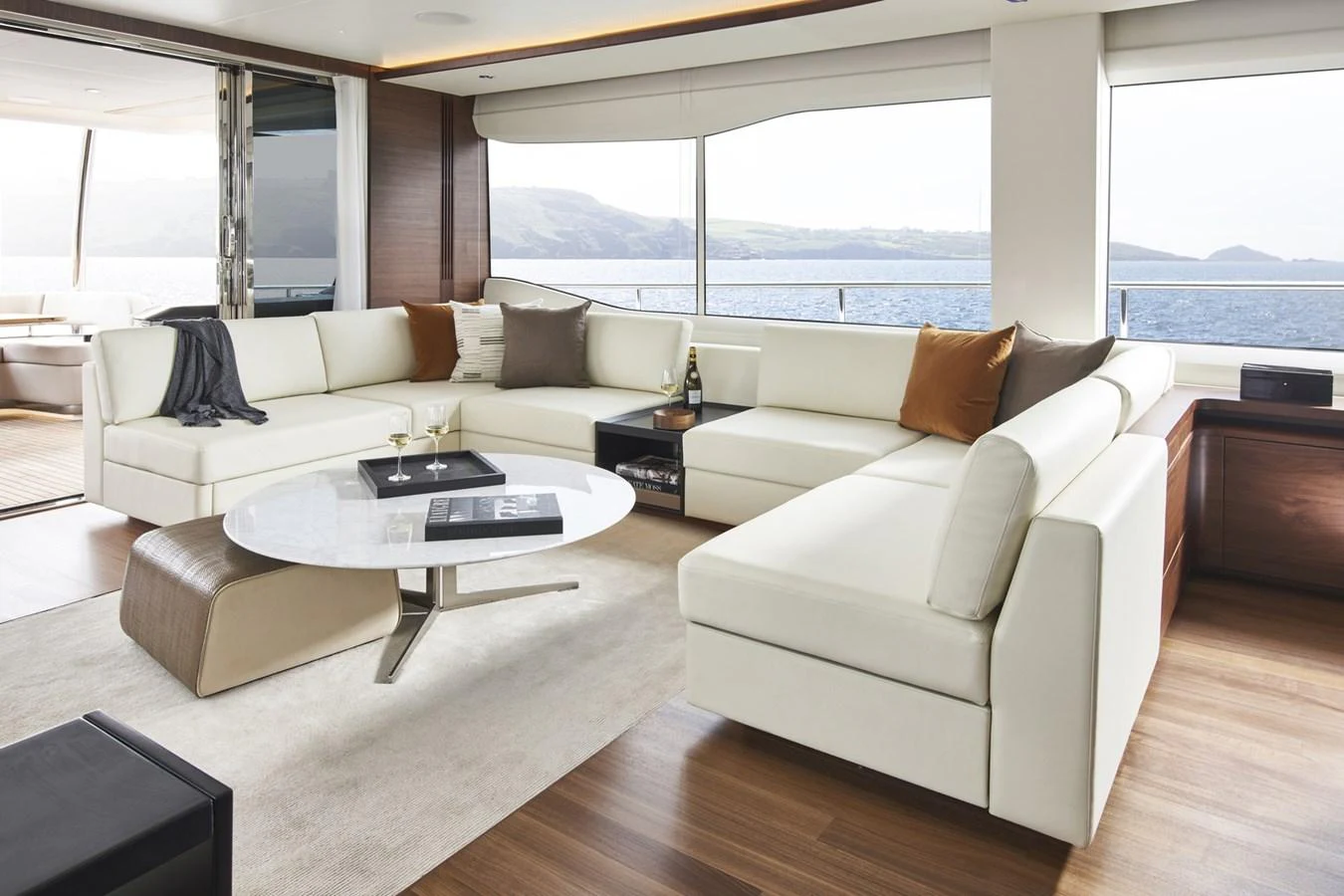 a living room with a large window aboard PRINCESS 85MY 2019 Yacht for Sale