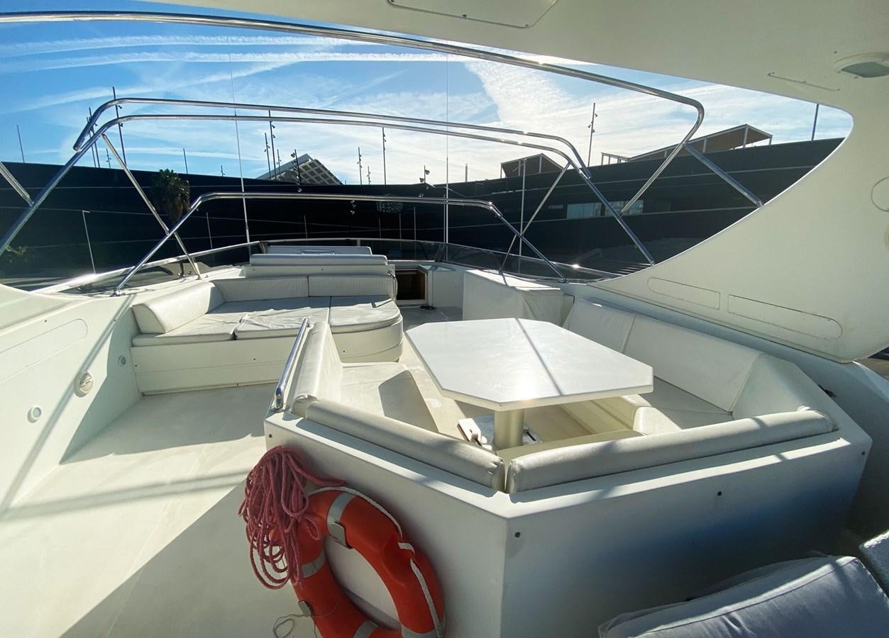 a white boat with red ropes aboard GRAN FINALE II Yacht for Sale
