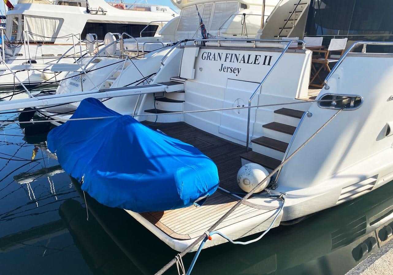 a boat is parked in a harbor aboard GRAN FINALE II Yacht for Sale