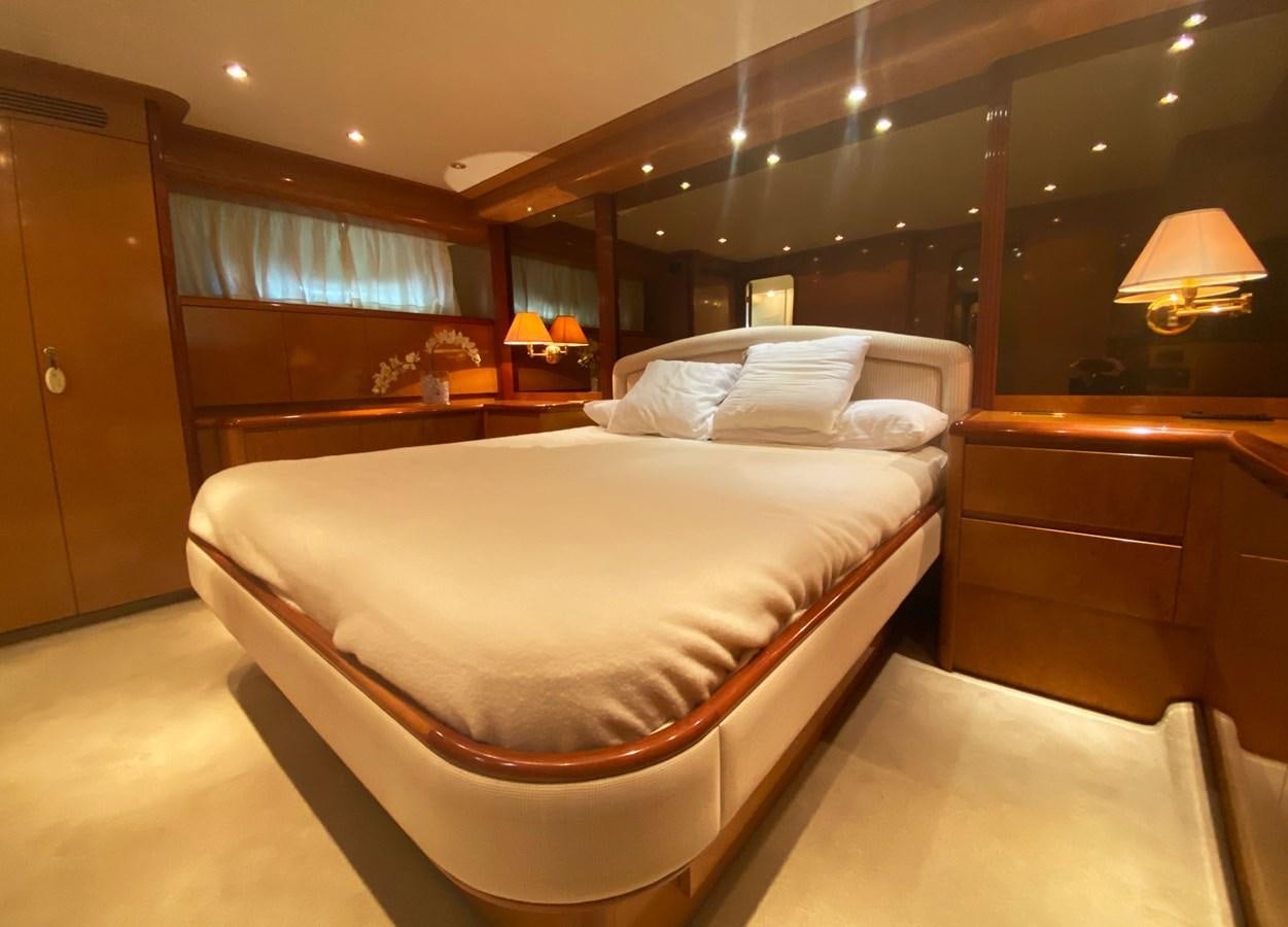 a large bed in a room aboard GRAN FINALE II Yacht for Sale