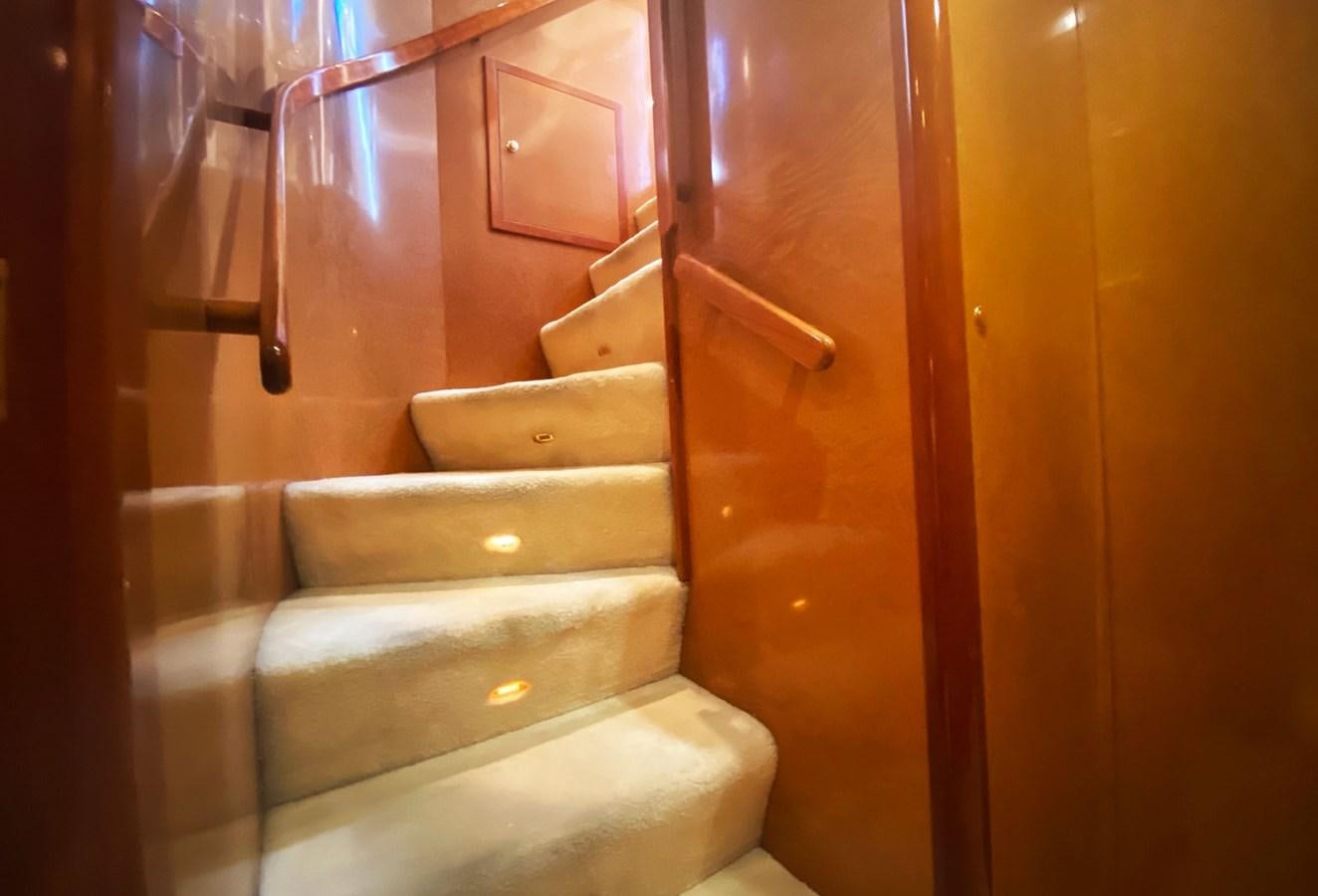 a staircase with a glass railing aboard GRAN FINALE II Yacht for Sale