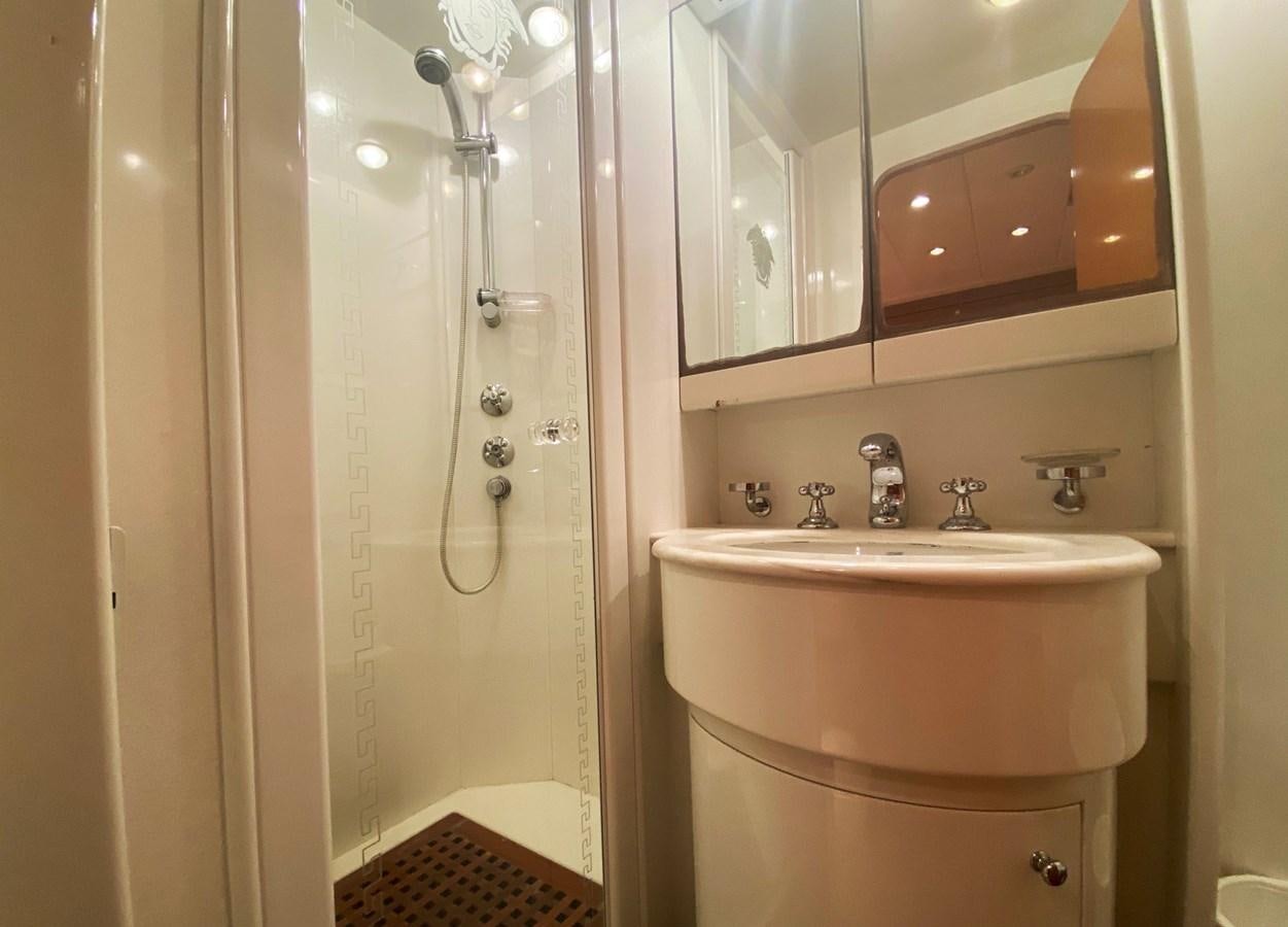 a bathroom with a sink and a shower aboard GRAN FINALE II Yacht for Sale