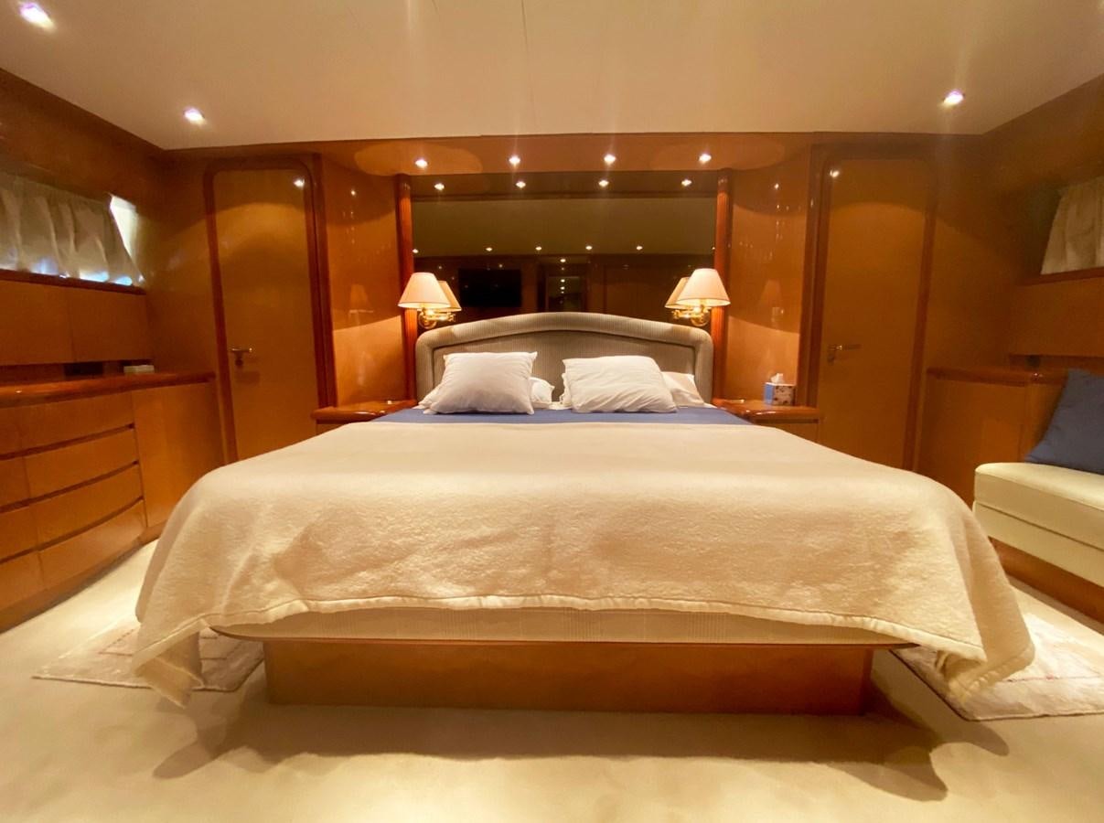 a bed with white sheets aboard GRAN FINALE II Yacht for Sale