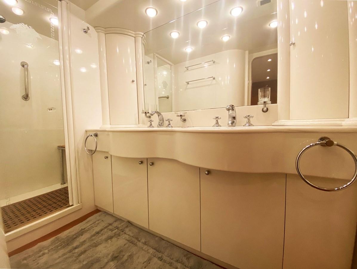 a bathroom with a large mirror aboard GRAN FINALE II Yacht for Sale