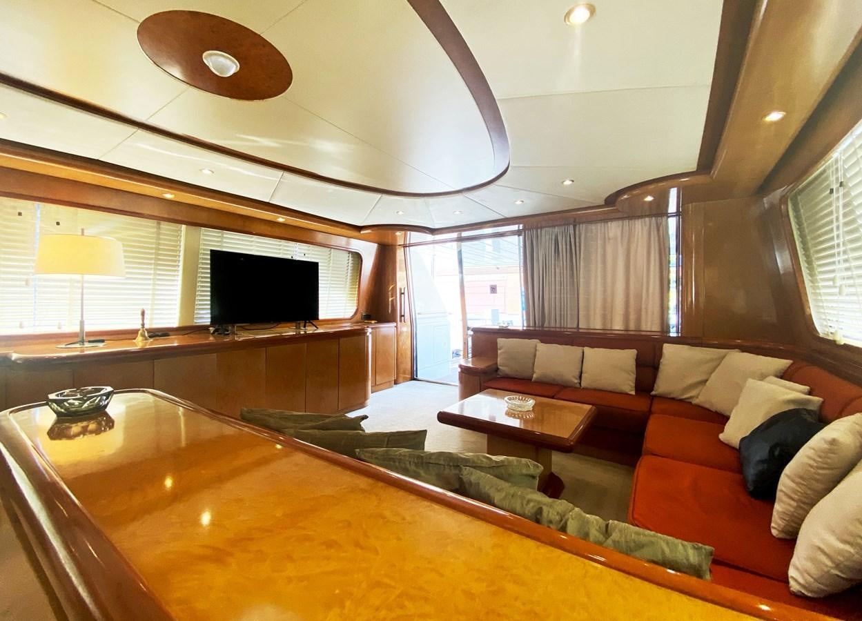 a living room with a large sofa aboard GRAN FINALE II Yacht for Sale