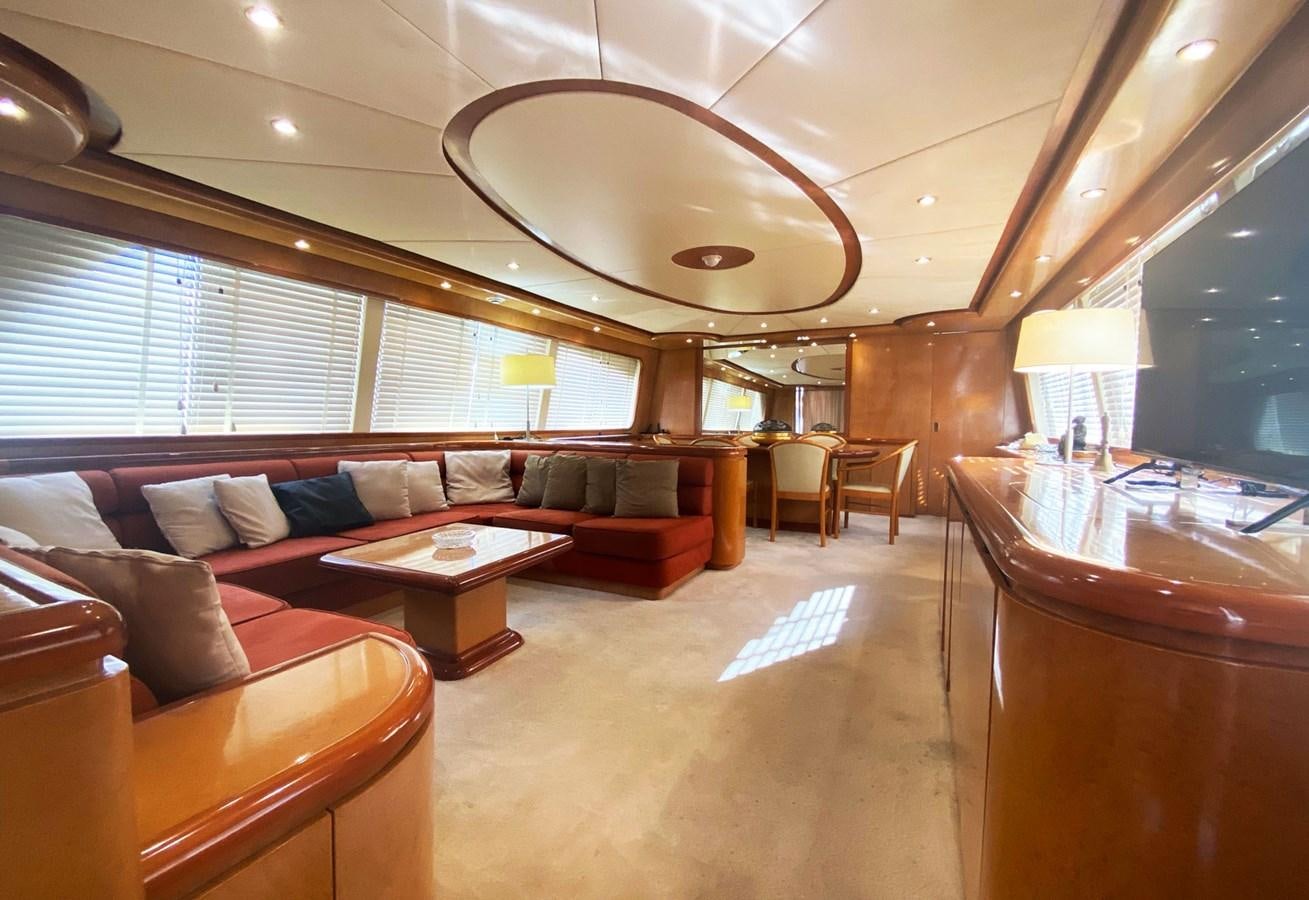 a living room with a couch and a table aboard GRAN FINALE II Yacht for Sale