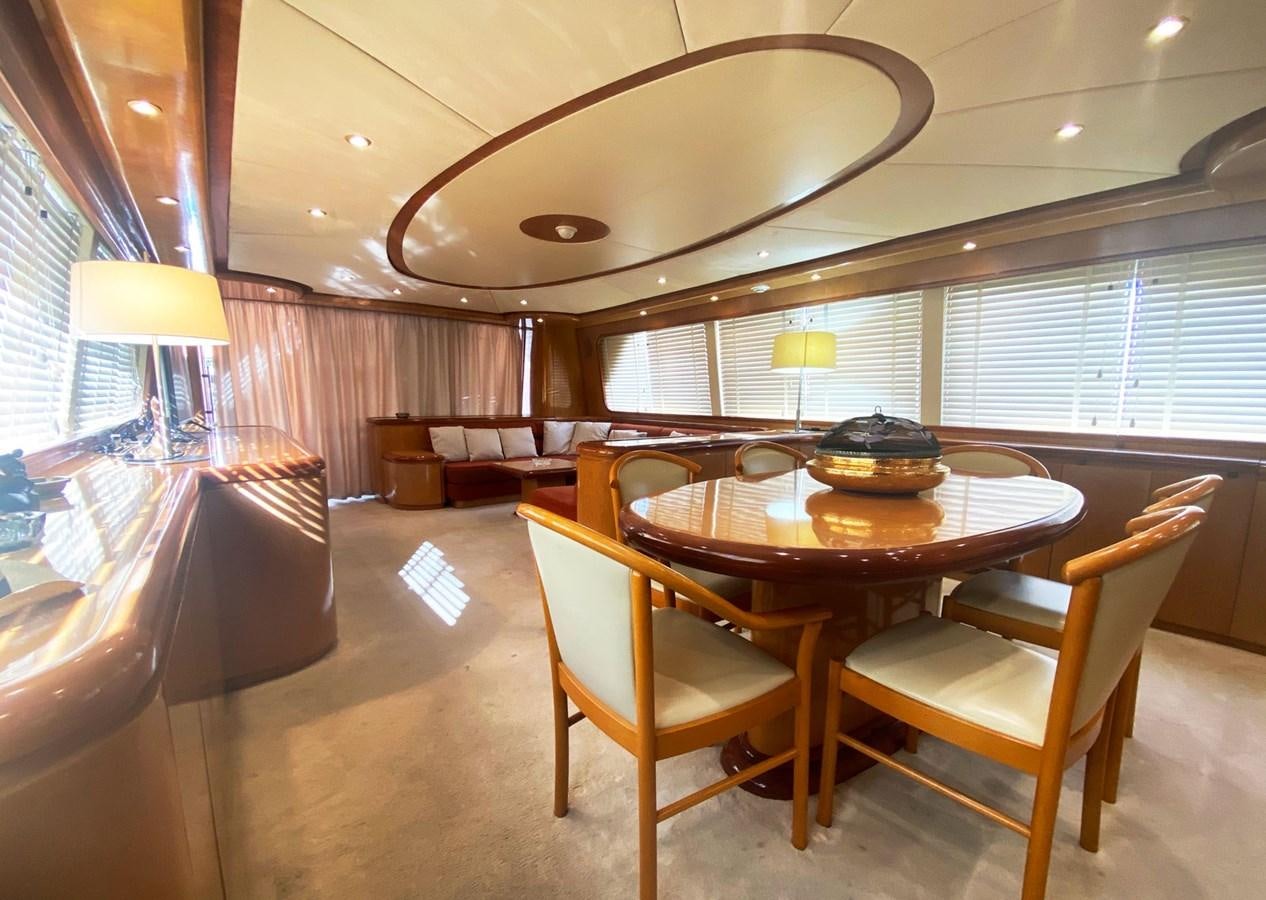 a dining table in a room aboard GRAN FINALE II Yacht for Sale