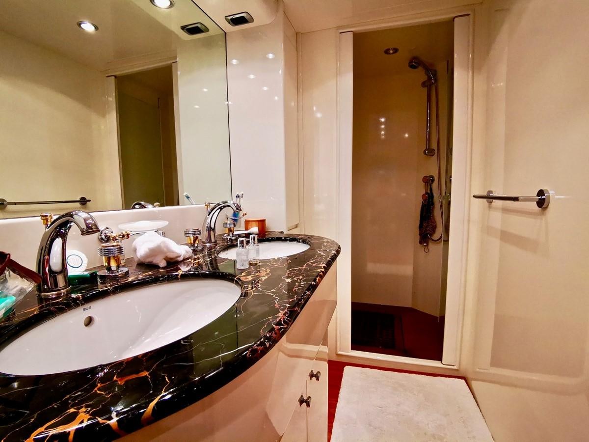 a bathroom with a large mirror aboard V BOYS Yacht for Sale