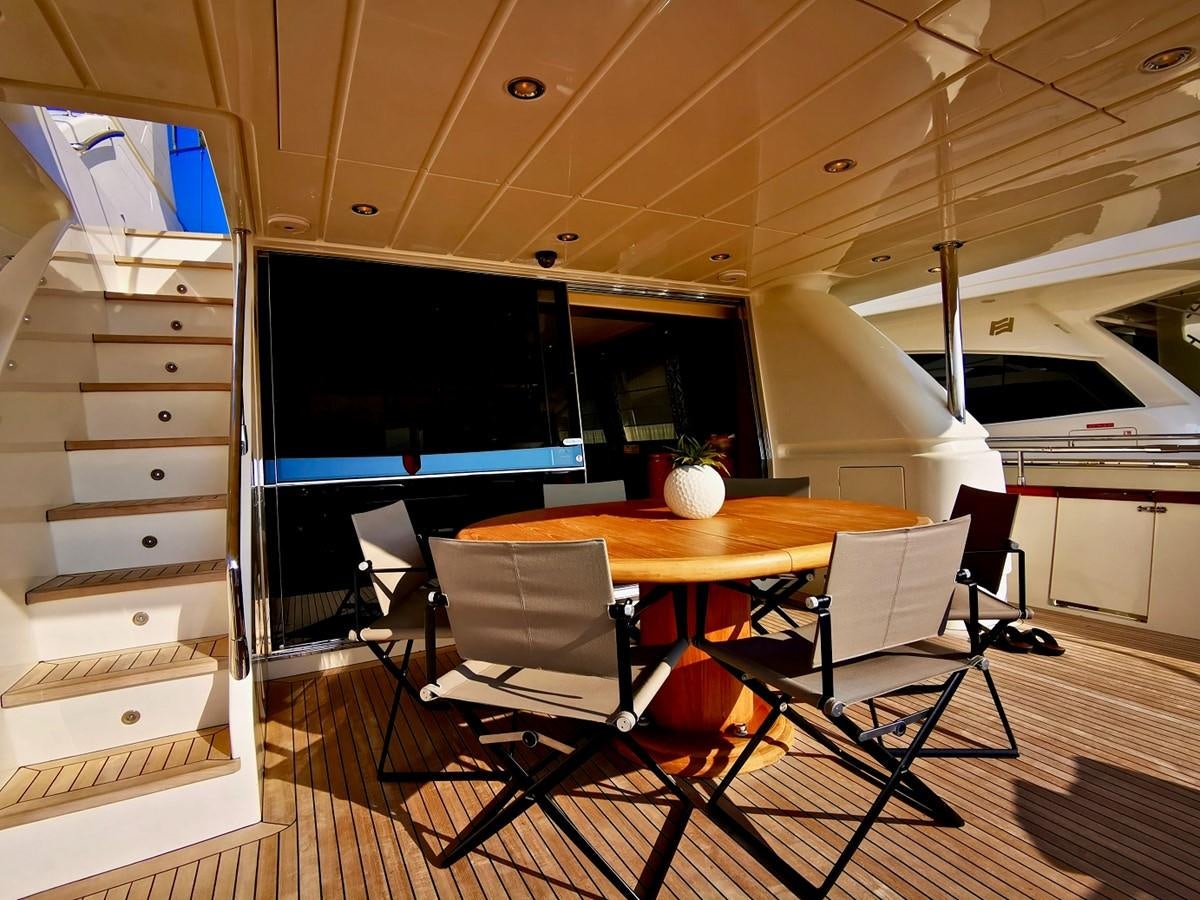 a room with a table and chairs aboard V BOYS Yacht for Sale