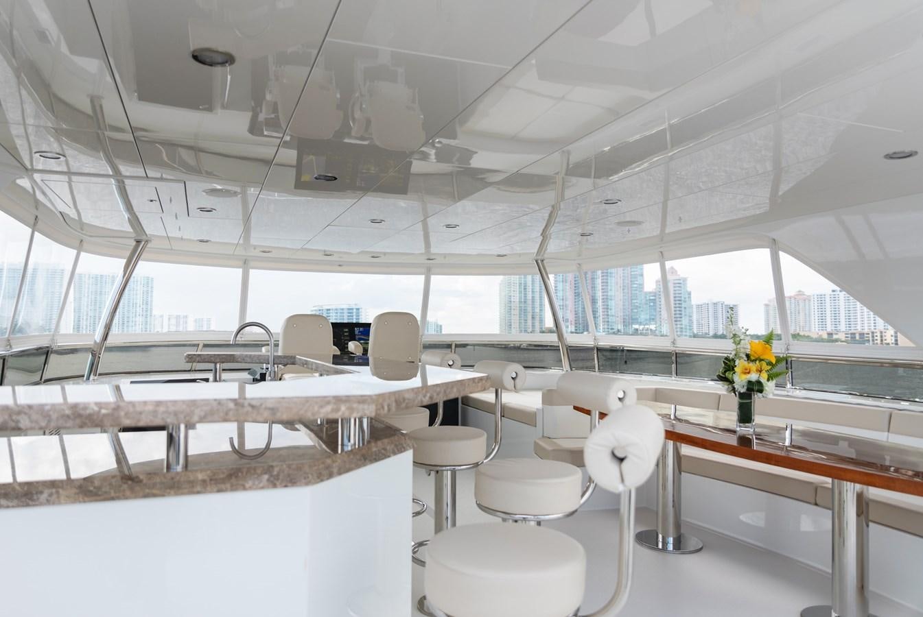 a room with tables and chairs aboard OCEAN ROSE Yacht for Sale