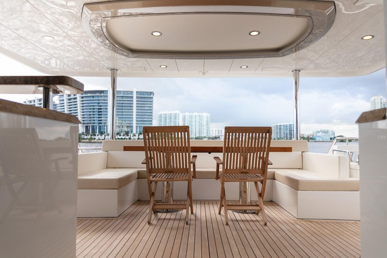 a room with a table and chairs aboard OCEAN ROSE Yacht for Sale