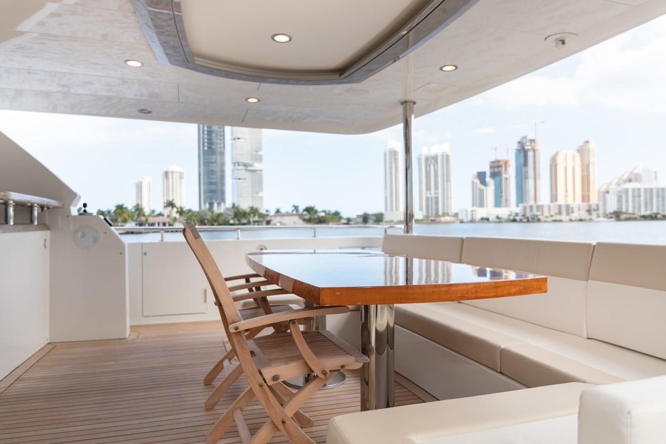 a room with tables and chairs aboard OCEAN ROSE Yacht for Sale