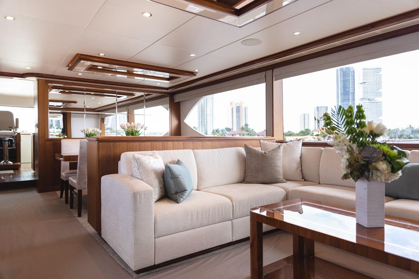 a living room with a couch and a table aboard OCEAN ROSE Yacht for Sale