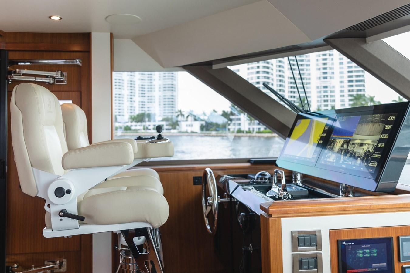 a white chair in a room aboard OCEAN ROSE Yacht for Sale