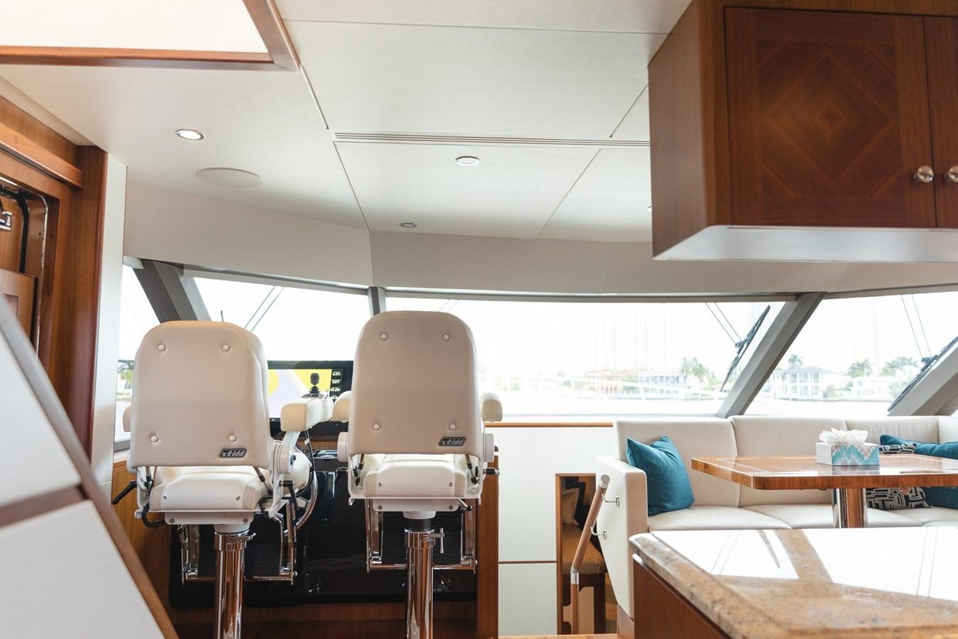 a room with chairs and tables aboard OCEAN ROSE Yacht for Sale