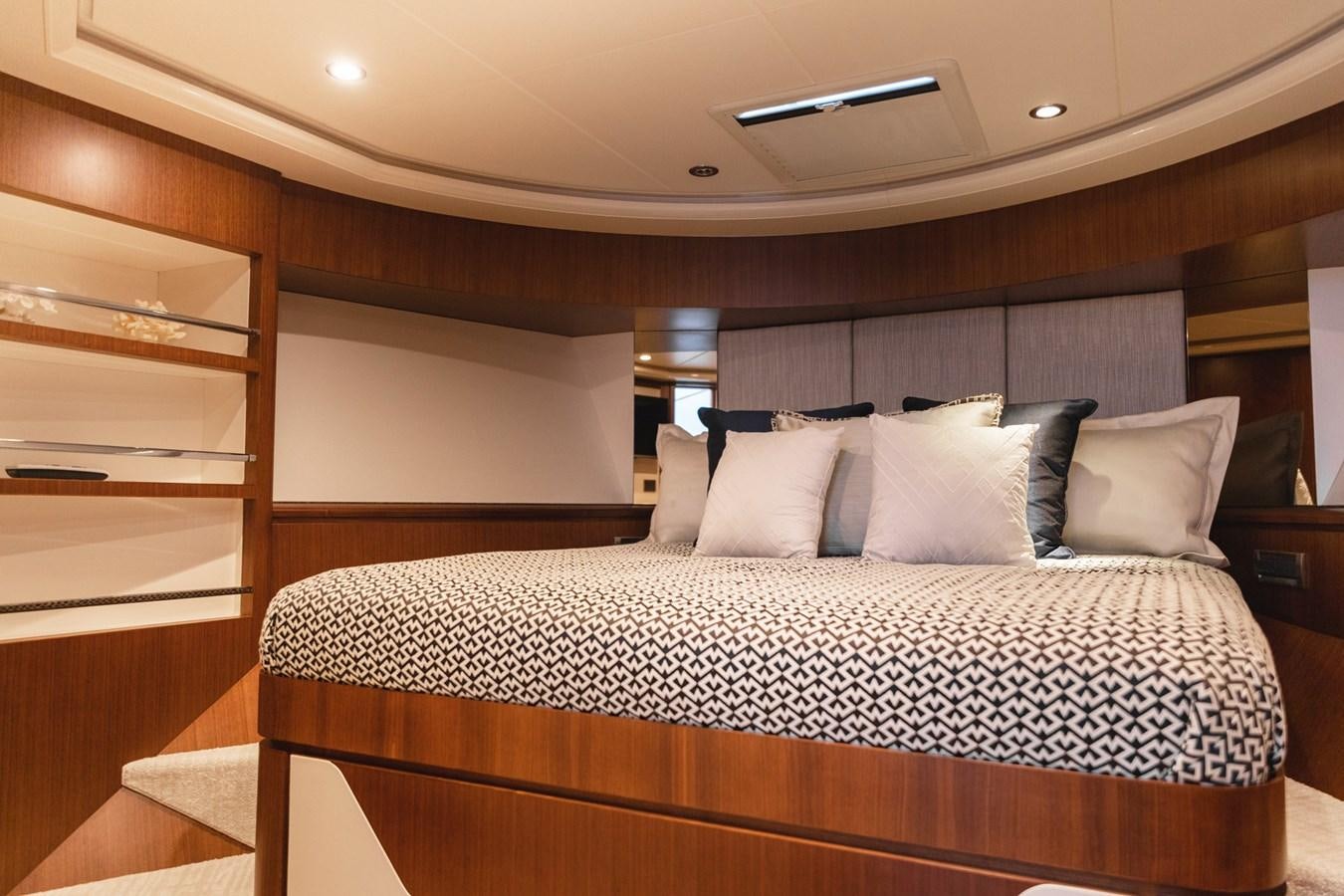 a bed with a white comforter aboard OCEAN ROSE Yacht for Sale