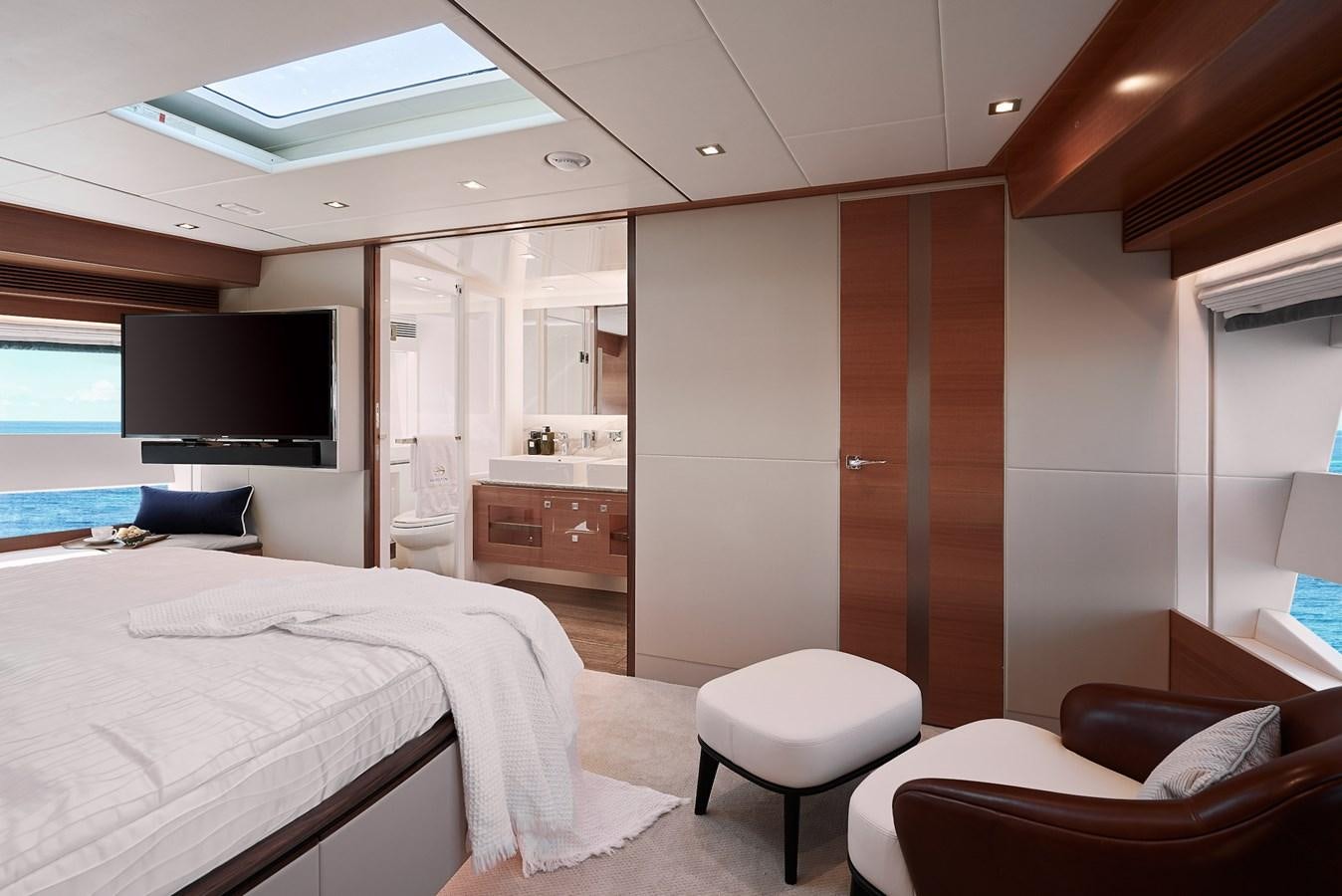 a room with a bed and a television aboard FD85 (NEW BOAT SPEC)  Yacht for Sale