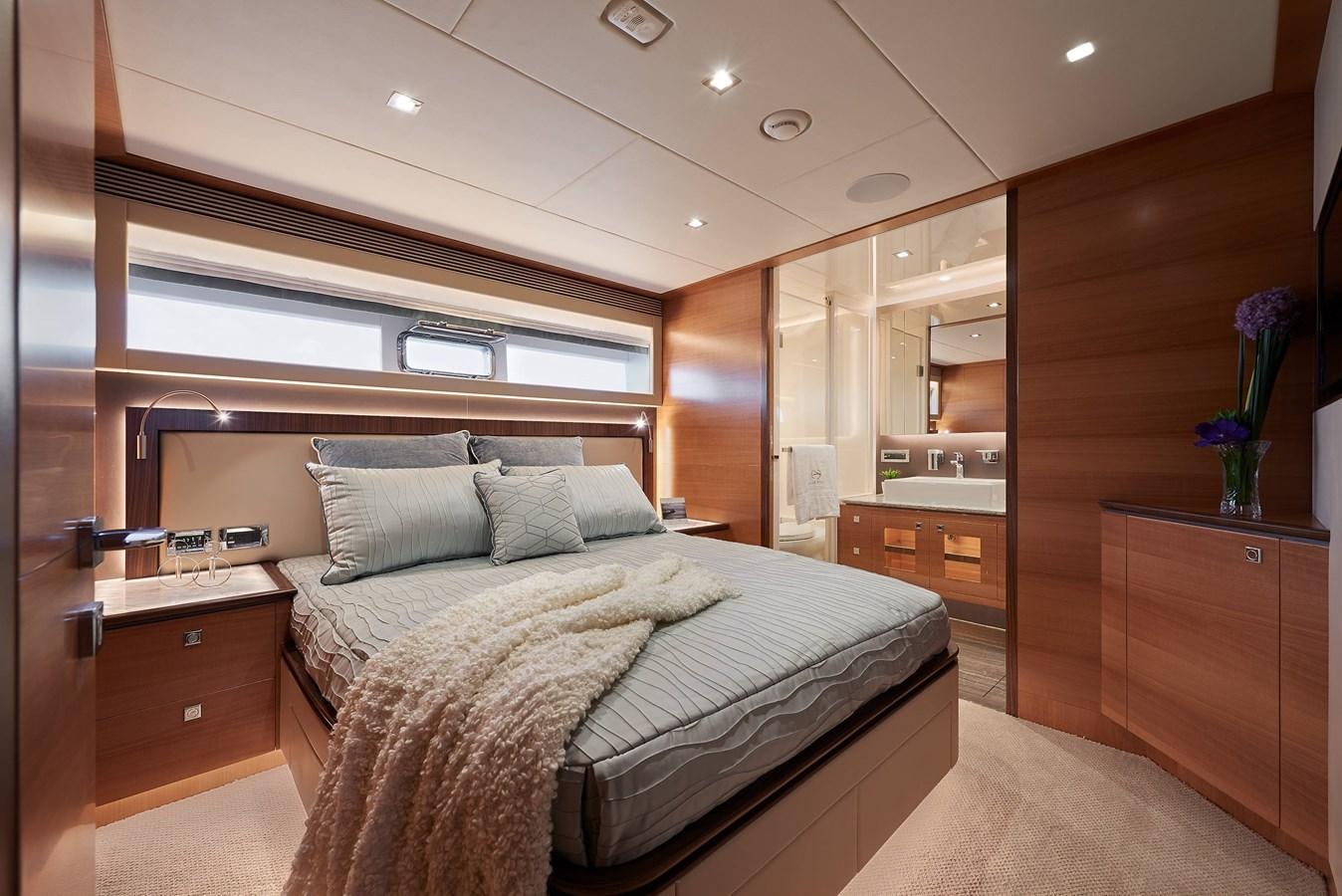 a bedroom with a bed and a wood cabinet aboard FD85 (NEW BOAT SPEC)  Yacht for Sale