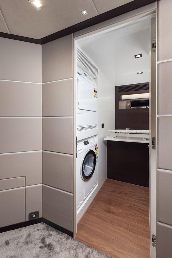 a room with a washer and dryer aboard FD85 (NEW BOAT SPEC)  Yacht for Sale