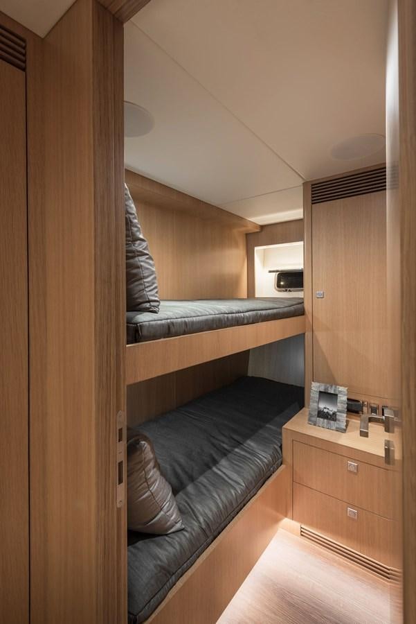 a room with a bed and a desk aboard FD85 (NEW BOAT SPEC)  Yacht for Sale