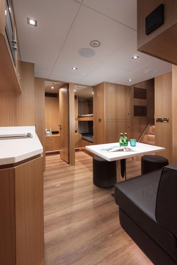 a kitchen with a bar and a table aboard FD85 (NEW BOAT SPEC)  Yacht for Sale