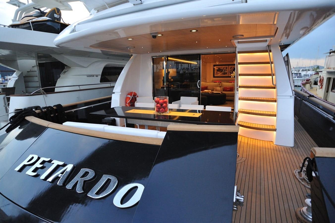 a large room with a table and chairs aboard PETARDO C Yacht for Sale