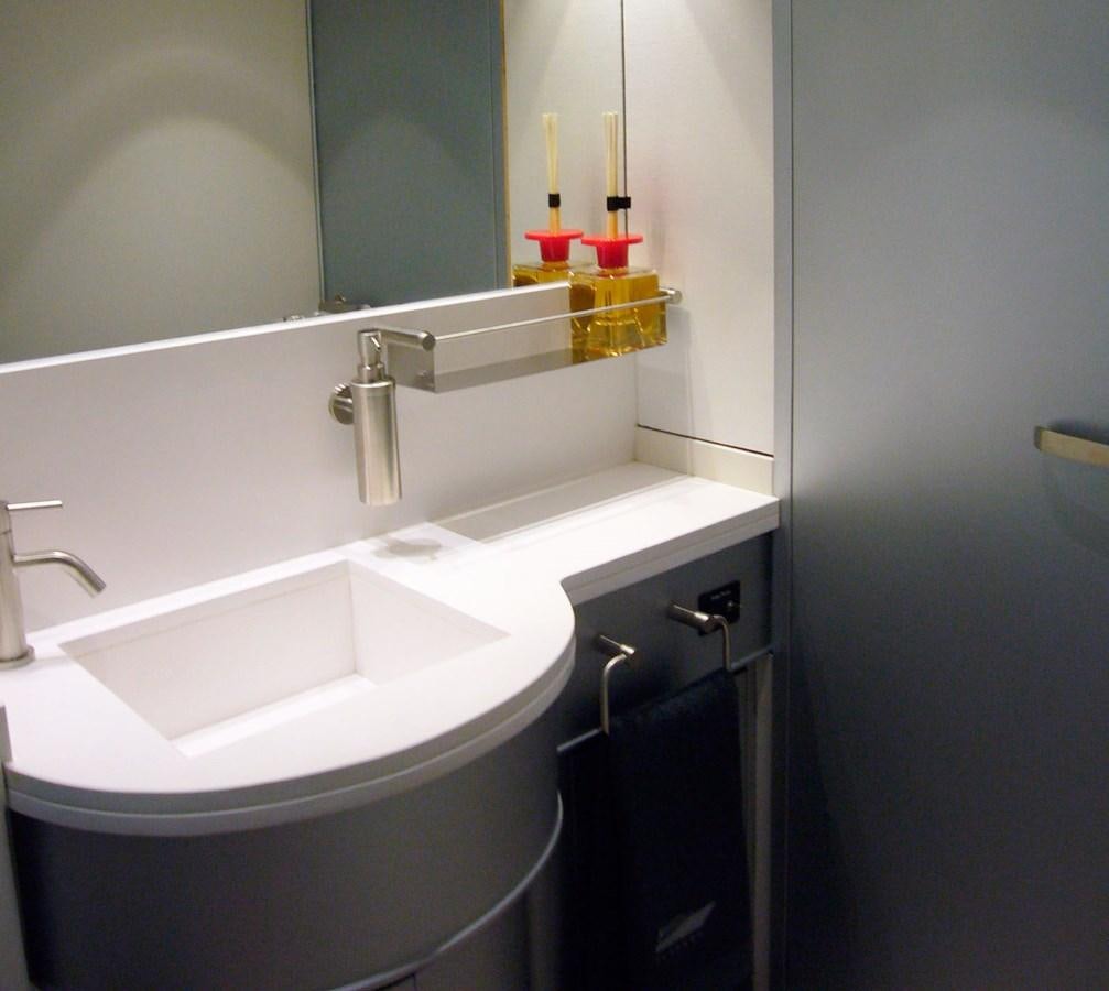 a bathroom with two sinks aboard PETARDO C Yacht for Sale